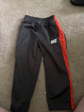 Nike Kids Charcoal Joggers with Red Side Stripe